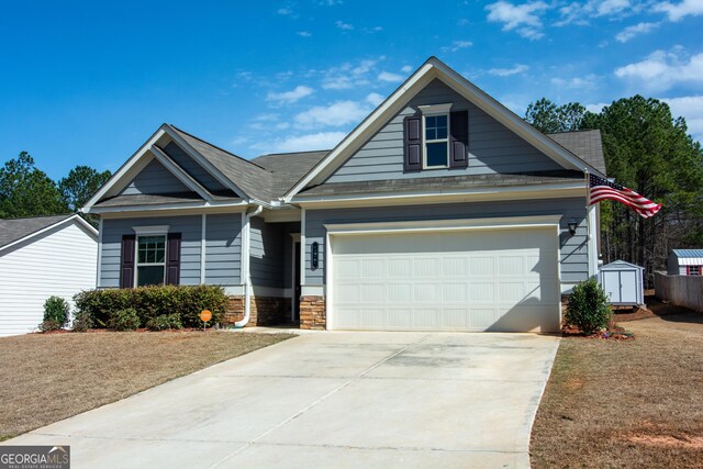 view of front of home with a garage and concrete driveway