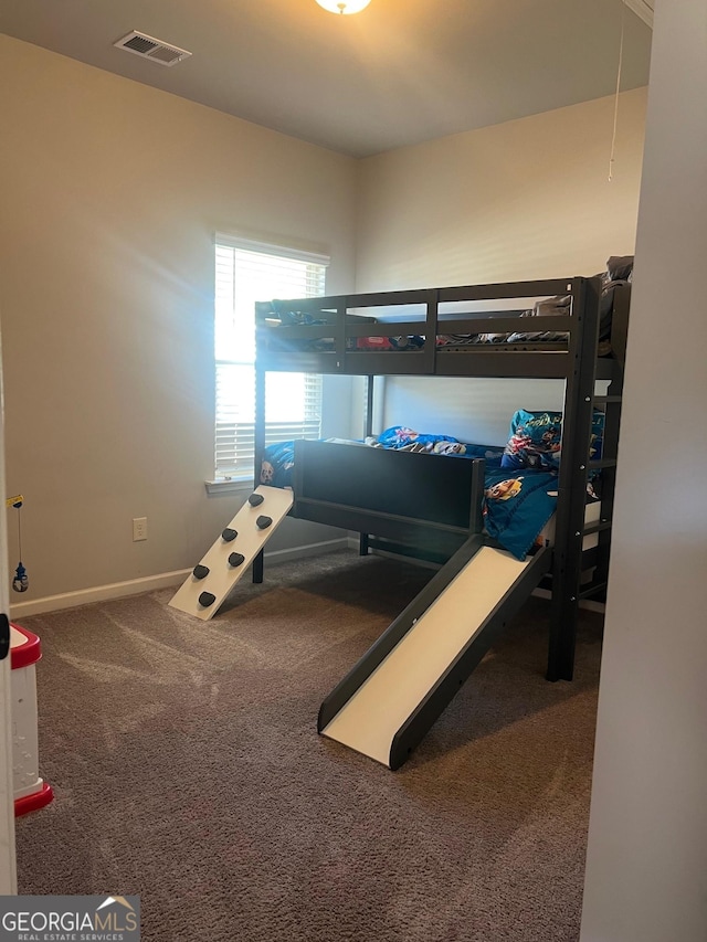 bedroom featuring visible vents, carpet floors, and baseboards