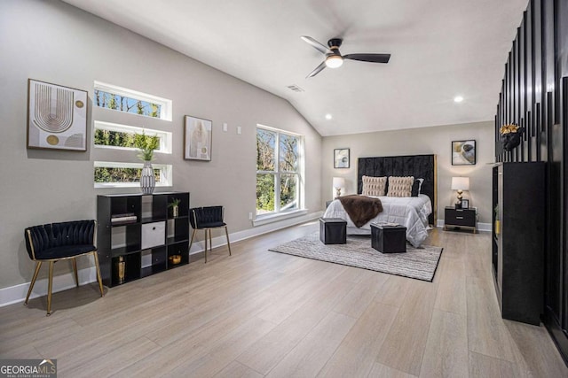 bedroom with baseboards, vaulted ceiling, wood finished floors, and recessed lighting