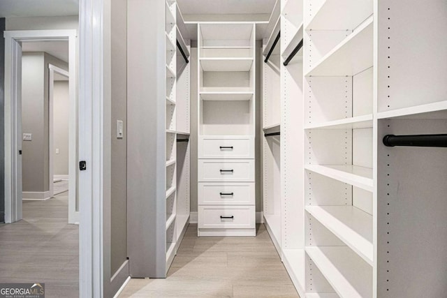 spacious closet with light wood finished floors