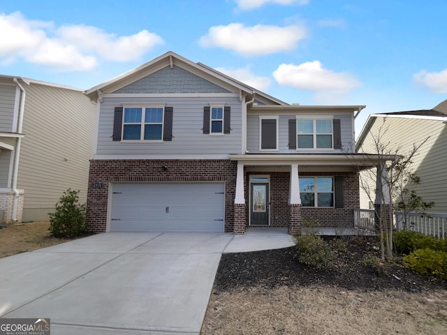 craftsman house with concrete driveway, a porch, an attached garage, and brick siding