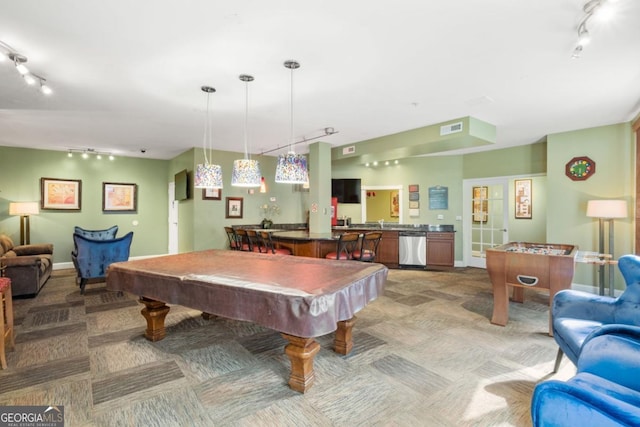 rec room with light carpet, billiards, visible vents, rail lighting, and wet bar