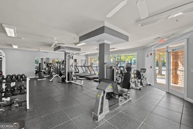 workout area featuring ceiling fan, ornamental molding, and baseboards