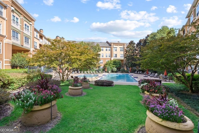 pool featuring a yard and a patio