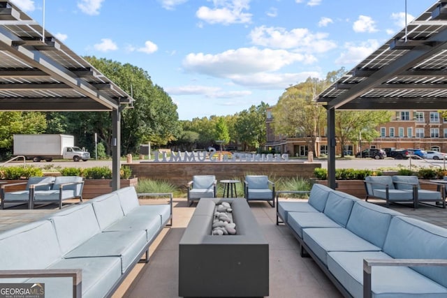 view of patio / terrace with an outdoor living space and a pergola