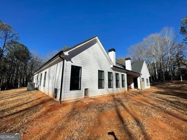 view of side of property featuring a chimney