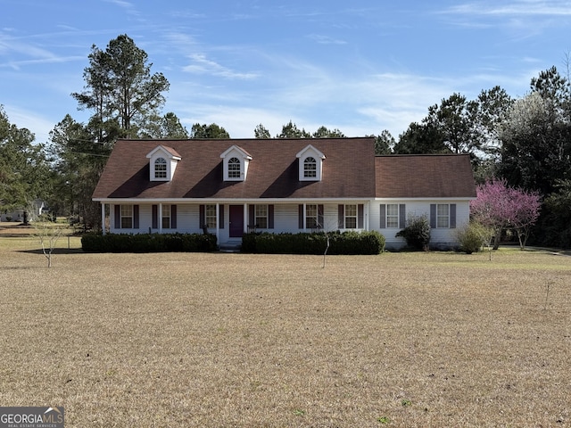 new england style home with a front lawn