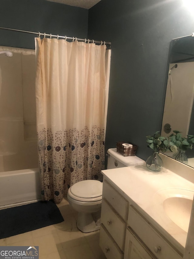 bathroom with toilet, shower / tub combo, and vanity