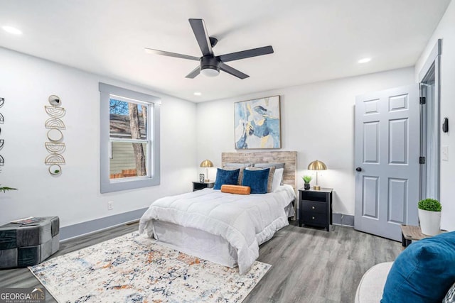 bedroom featuring recessed lighting, ceiling fan, baseboards, and wood finished floors