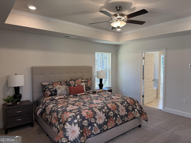 carpeted bedroom with a ceiling fan, baseboards, visible vents, and crown molding