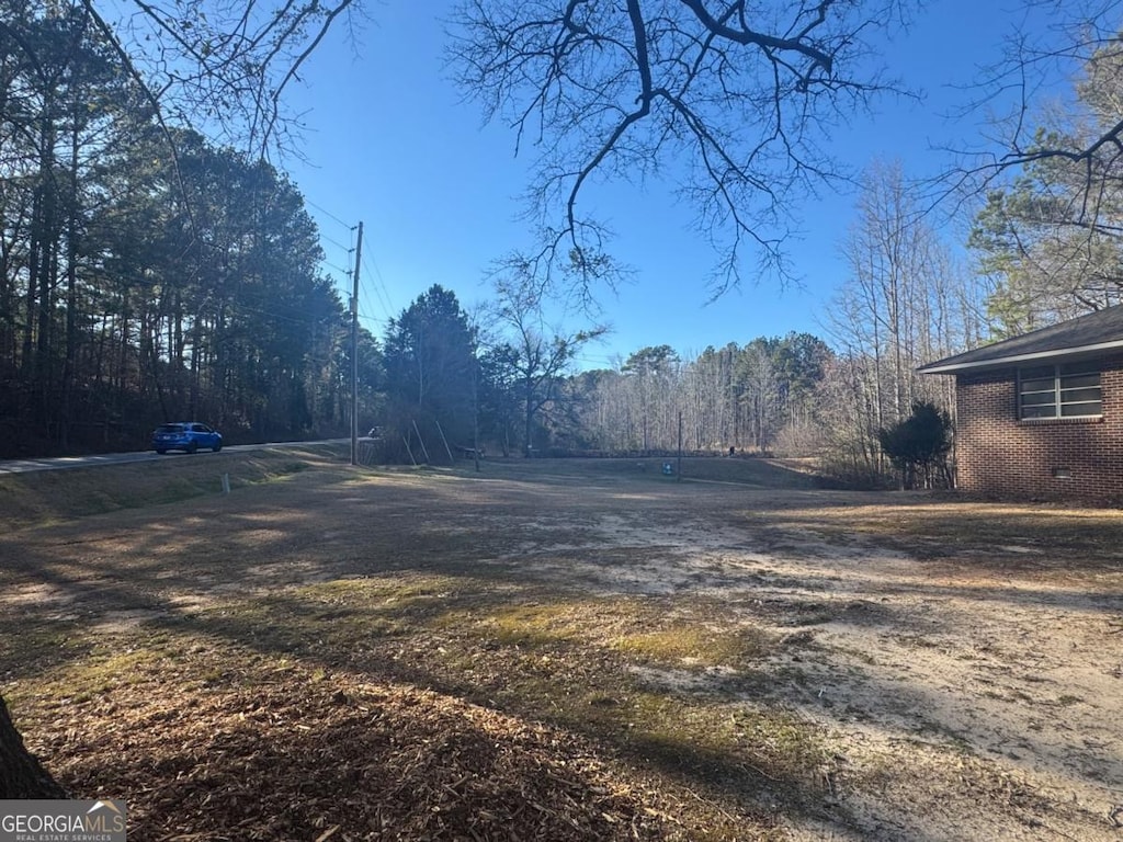 view of street featuring a wooded view