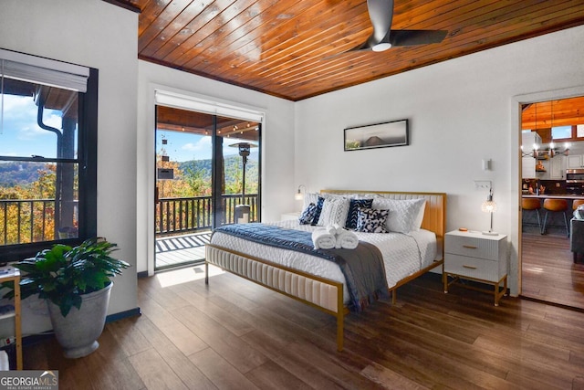 bedroom featuring access to exterior, wood ceiling, crown molding, and wood finished floors