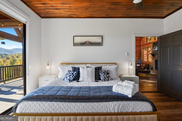 bedroom featuring access to outside, wooden ceiling, and wood finished floors