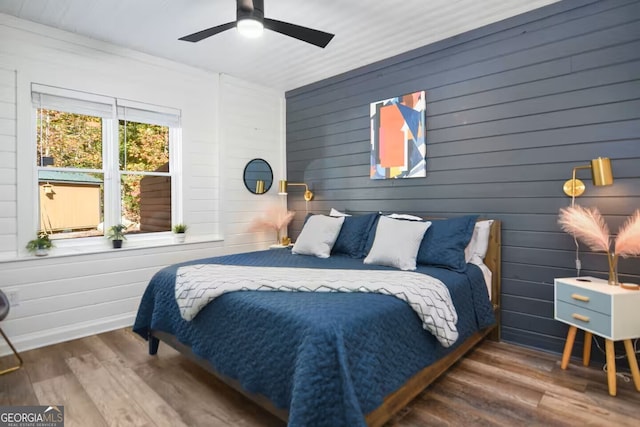 bedroom with wood finished floors and a ceiling fan