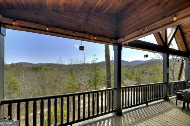 deck featuring a forest view