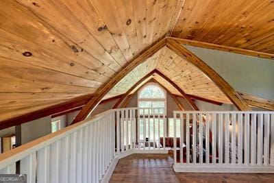 additional living space featuring lofted ceiling and wooden ceiling