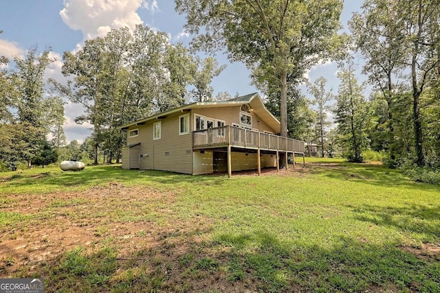 exterior space featuring a lawn and a wooden deck