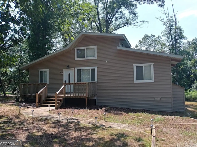 view of front of house featuring a wooden deck