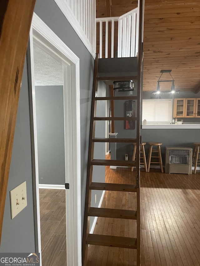 staircase featuring wood finished floors