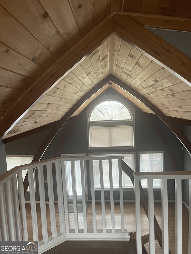 additional living space featuring wooden ceiling and vaulted ceiling