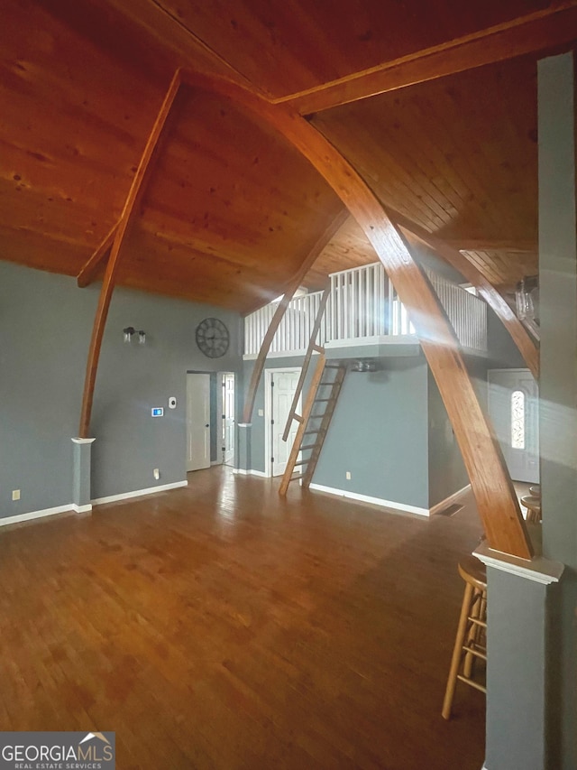 bonus room with wooden ceiling, stairway, baseboards, and wood finished floors