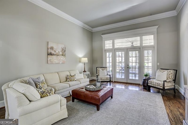 living area with french doors, baseboards, crown molding, and dark wood-style flooring