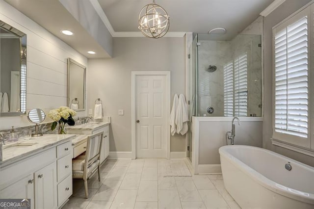 bathroom with a soaking tub, crown molding, a shower stall, and double vanity