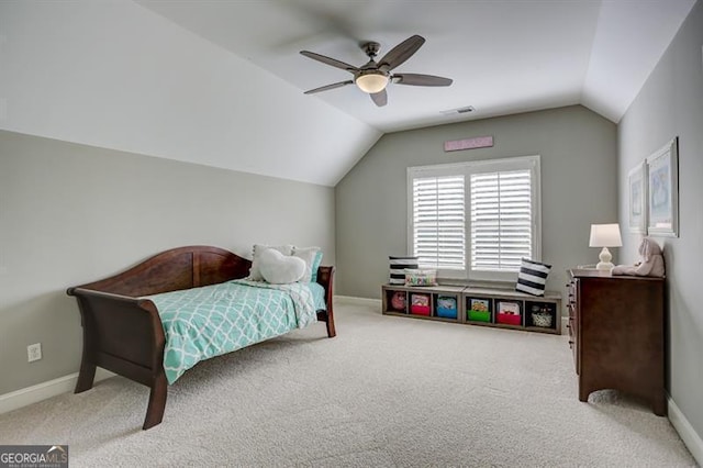 bedroom with carpet floors, lofted ceiling, and baseboards