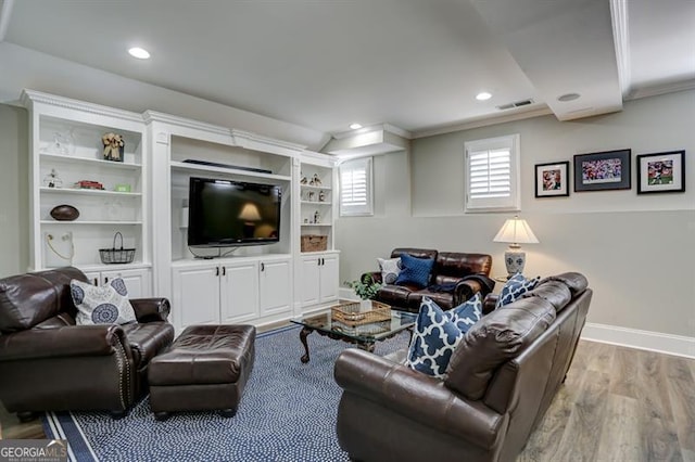 living area featuring crown molding, recessed lighting, visible vents, light wood-style flooring, and baseboards