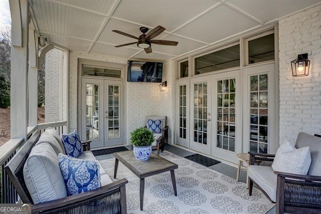 view of patio with ceiling fan, an outdoor living space, and french doors