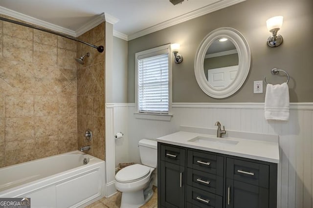 bathroom with a wainscoted wall, toilet, ornamental molding, vanity, and  shower combination