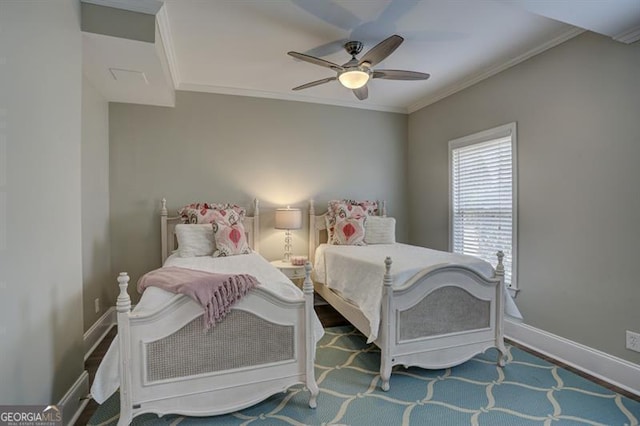 bedroom with a ceiling fan, crown molding, and baseboards