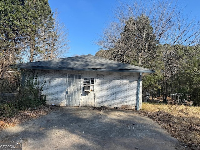 view of outbuilding with cooling unit