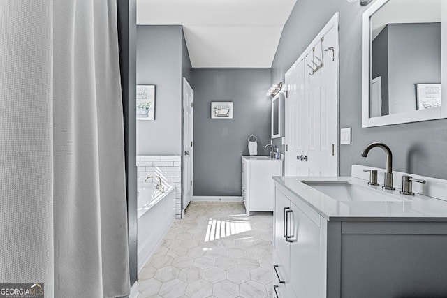 full bathroom with tile patterned flooring, two vanities, a sink, baseboards, and a bath