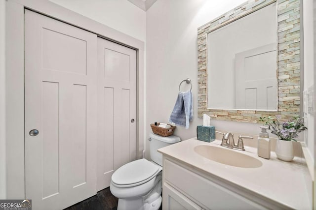 203 Hubbard Rd, Woodstock, GA 30188 - bathroom with vanity, wood finished floors, and toilet
