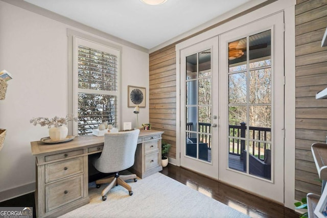 home office featuring baseboards, french doors, wood finished floors, and a healthy amount of sunlight