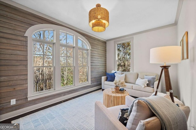 living area featuring wood walls