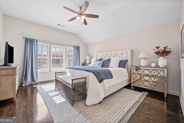 bedroom with baseboards, visible vents, ceiling fan, wood finished floors, and vaulted ceiling