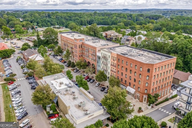 drone / aerial view featuring a forest view