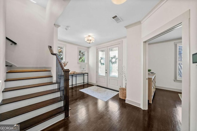 entrance foyer featuring wood finished floors, visible vents, baseboards, french doors, and stairway