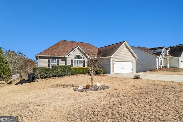 ranch-style house with driveway and an attached garage