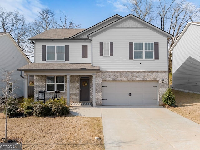 traditional-style home with concrete driveway, an attached garage, covered porch, and a shingled roof