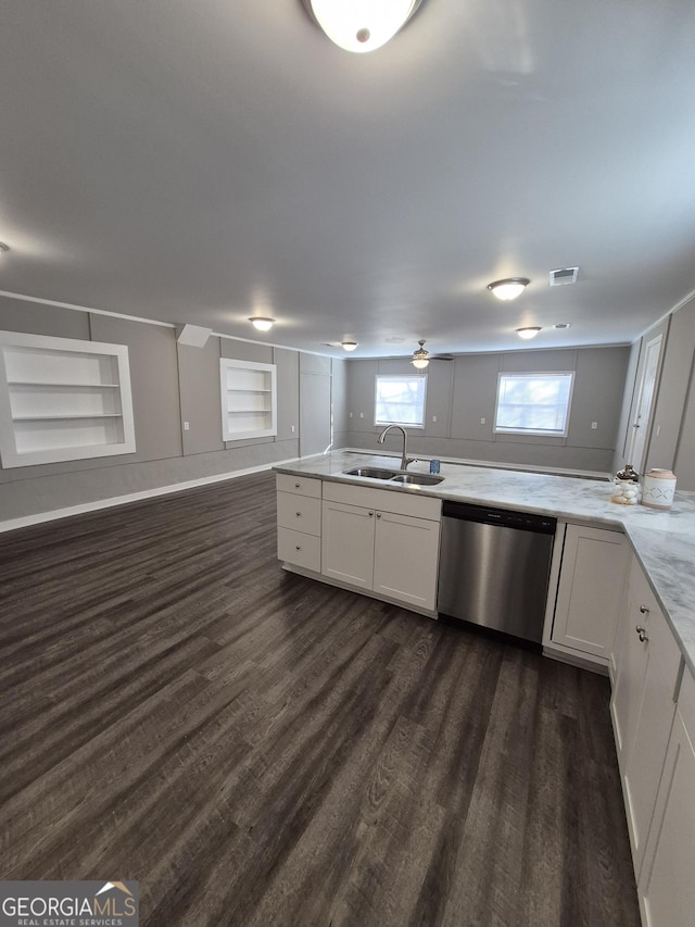 unfurnished living room featuring dark wood-style flooring, baseboards, and a ceiling fan
