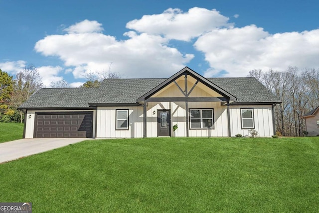 view of front of house with a garage, concrete driveway, a front lawn, and board and batten siding