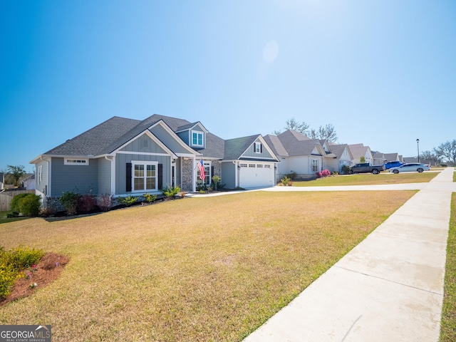 view of front of home with a garage, driveway, a residential view, a front lawn, and board and batten siding