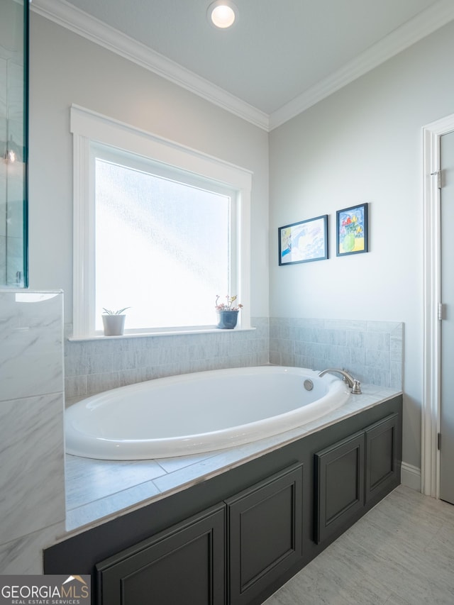 full bath featuring a bath and crown molding