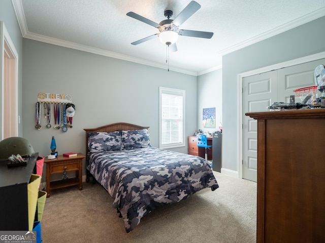 bedroom featuring carpet, a textured ceiling, baseboards, and crown molding