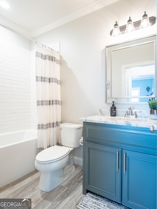 full bath featuring shower / bath combo, toilet, crown molding, vanity, and wood finish floors