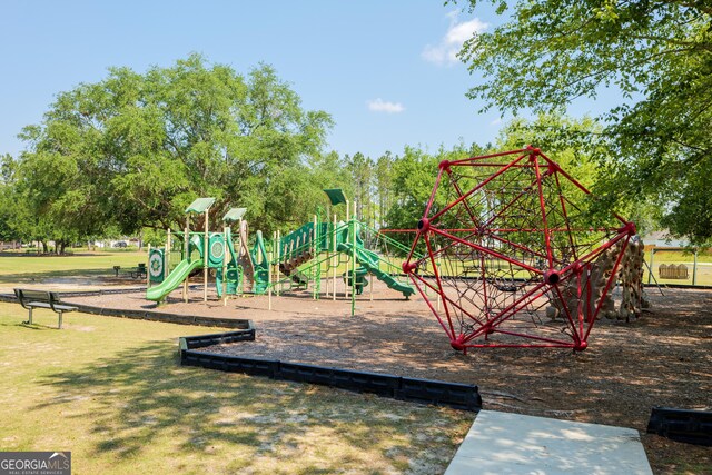 community play area with a lawn