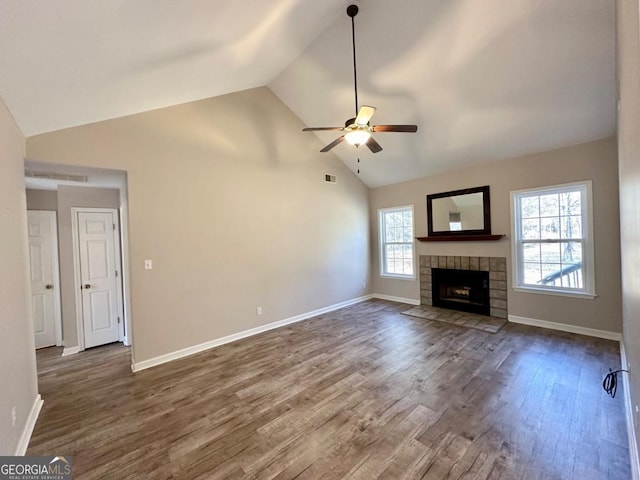 unfurnished living room featuring dark wood-style floors, baseboards, and a ceiling fan